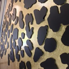 Laser cut panther spots to gold leaf